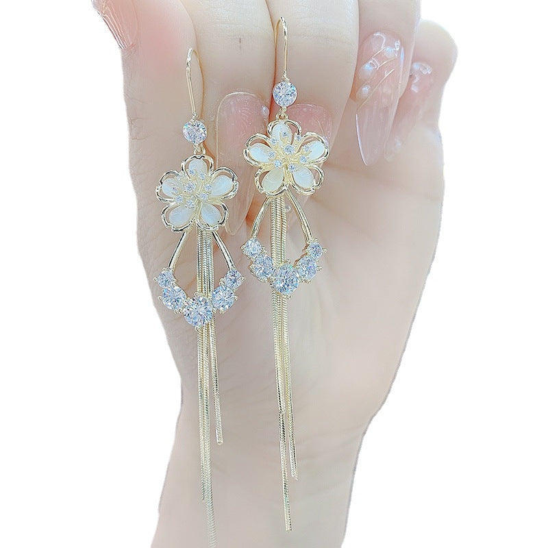 New cat's eye stone earrings fashion temperament long tassels show thin face earrings