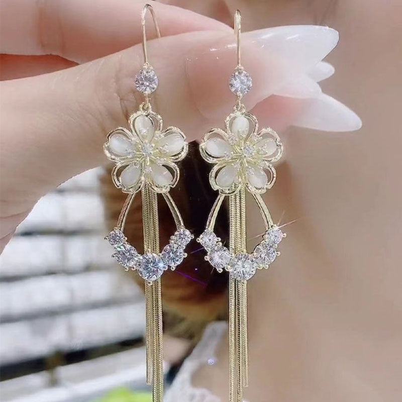 New cat's eye stone earrings fashion temperament long tassels show thin face earrings