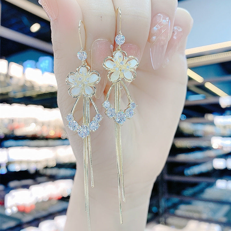 New cat's eye stone earrings fashion temperament long tassels show thin face earrings