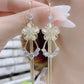 New cat's eye stone earrings fashion temperament long tassels show thin face earrings
